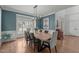 Elegant dining room featuring a modern chandelier, large windows, and stylish decor at 1420 Heritage Links Dr, Wake Forest, NC 27587