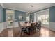 Well-lit dining room with a wooden table, comfortable seating, and decorative accents at 1420 Heritage Links Dr, Wake Forest, NC 27587