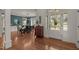 Welcoming foyer with hardwood floors, a vintage desk, and a view into the dining room at 1420 Heritage Links Dr, Wake Forest, NC 27587