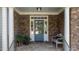 The exterior of this home boasts a stone facade and decorative front door at 1420 Heritage Links Dr, Wake Forest, NC 27587