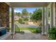 Covered front porch offering neighborhood views with stone columns and classic railings at 1420 Heritage Links Dr, Wake Forest, NC 27587