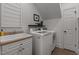 Bright laundry room featuring a utility sink, washing machine, and dryer at 1420 Heritage Links Dr, Wake Forest, NC 27587