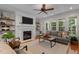 Bright and airy living room with a fireplace and comfortable seating, ideal for relaxing at 1420 Heritage Links Dr, Wake Forest, NC 27587
