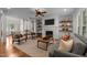 An open-concept living room features a fireplace, tv, and comfortable seating, perfect for entertaining at 1420 Heritage Links Dr, Wake Forest, NC 27587