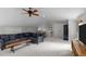 Open concept living room with vaulted ceiling, ceiling fan, and a wooden coffee table at 1420 Heritage Links Dr, Wake Forest, NC 27587