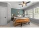 A beautifully styled main bedroom boasts many windows and a light wood bed frame at 1420 Heritage Links Dr, Wake Forest, NC 27587