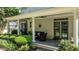 Inviting back porch with ceiling fans, comfortable seating, and well-maintained greenery at 1420 Heritage Links Dr, Wake Forest, NC 27587