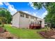 Spacious backyard featuring a deck, a screened-in porch and lush landscaping at 1480 Big Leaf Loop, Apex, NC 27502