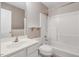 This bathroom features a vanity, mirror, shelving, toilet, and a shower with a shower head at 1480 Big Leaf Loop, Apex, NC 27502