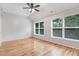Sunlit bedroom offers vaulted ceilings, ceiling fan, and large window views at 1480 Big Leaf Loop, Apex, NC 27502