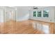 Spacious bedroom features hardwood floors, three large windows, and a ceiling fan at 1480 Big Leaf Loop, Apex, NC 27502