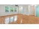 Large bedroom boasts hardwood floors, multiple windows, and ample natural light at 1480 Big Leaf Loop, Apex, NC 27502