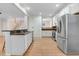 Well-equipped kitchen with white cabinetry, stainless steel appliances, and a functional layout at 1480 Big Leaf Loop, Apex, NC 27502