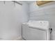 Bright laundry room featuring a washer, a dryer, and wire shelving for convenient storage at 1480 Big Leaf Loop, Apex, NC 27502