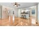 Spacious living area featuring hardwood floors, open layout, and staircase at 1480 Big Leaf Loop, Apex, NC 27502
