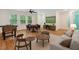 Cozy living room features a foosball table, a ceiling fan, and entertainment area with a mounted tv at 1480 Big Leaf Loop, Apex, NC 27502