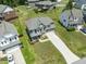Aerial view of a two-story home with manicured front yard and long drive at 1499 Fireside Ln, Creedmoor, NC 27522