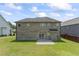 Large backyard on a two-story brick home with patio and manicured lawn at 1499 Fireside Ln, Creedmoor, NC 27522