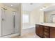 Bathroom featuring separate tub and shower with dark cabinets and light walls at 1499 Fireside Ln, Creedmoor, NC 27522