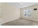 Neutral bedroom with a window with blinds and neutral carpet at 1499 Fireside Ln, Creedmoor, NC 27522