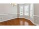 Cozy dining nook with natural light, hardwood floors, and elegant trim throughout the space at 1499 Fireside Ln, Creedmoor, NC 27522