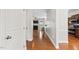 Inviting entryway with hardwood floors leading to the living room with fireplace at 1499 Fireside Ln, Creedmoor, NC 27522