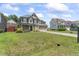 Lovely front exterior showcases the home's architecture, landscaping, and spacious front yard at 1499 Fireside Ln, Creedmoor, NC 27522