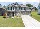 Charming two-story home featuring brick and siding, complemented by a well-manicured lawn and inviting curb appeal at 1499 Fireside Ln, Creedmoor, NC 27522