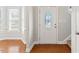 Bright foyer with hardwood floors and decorative front door at 1499 Fireside Ln, Creedmoor, NC 27522