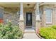 Close-up view of front porch with brick columns and detailed front door at 1499 Fireside Ln, Creedmoor, NC 27522