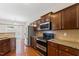 Well-equipped kitchen with stainless appliances, granite countertops, and ample cabinet space at 1499 Fireside Ln, Creedmoor, NC 27522