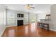 Inviting living room with fireplace, hardwood floors, and open access to the modern kitchen at 1499 Fireside Ln, Creedmoor, NC 27522