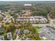 Aerial view of neighborhood featuring mature trees and landscaping at 15 Treviso Pl, Durham, NC 27707