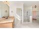 Primary bathroom with marble floors, a glass shower, and a granite countertop at 15 Treviso Pl, Durham, NC 27707