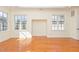Bright bedroom with hardwood floors and large windows at 15 Treviso Pl, Durham, NC 27707