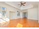 Spacious bedroom with hardwood floors and tray ceilings at 15 Treviso Pl, Durham, NC 27707