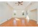 Large bedroom with tray ceiling, hardwood floors, and natural light at 15 Treviso Pl, Durham, NC 27707