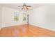 Bright bedroom with hardwood floors, crown molding, and a ceiling fan at 15 Treviso Pl, Durham, NC 27707