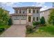 Beautiful two-story home with a two-car garage, ornate front entrance and lush landscaping at 15 Treviso Pl, Durham, NC 27707