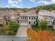 Beautiful two-story home with a well-manicured front yard, two-car garage, and balcony surrounded by trees at 15 Treviso Pl, Durham, NC 27707