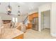 Bright kitchen featuring stainless steel appliances, granite countertops, and tile flooring at 15 Treviso Pl, Durham, NC 27707