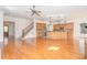 Open living room with hardwood floors, stairs, and a view of the kitchen at 15 Treviso Pl, Durham, NC 27707
