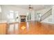 Inviting living room with hardwood floors, stone fireplace, and French doors leading to a sun-drenched patio at 15 Treviso Pl, Durham, NC 27707