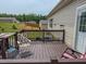 Cozy back deck with brown wood and a view of the fenced yard at 153 Bywood Dr, Roxboro, NC 27573
