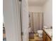 Cozy bathroom includes shower-tub, white toilet, and wood-look floors at 153 Bywood Dr, Roxboro, NC 27573