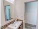 Simple bathroom features granite countertop, mirror, and stylish fixture at 153 Bywood Dr, Roxboro, NC 27573