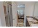 Modern bathroom with shower and view of bedroom with natural light at 153 Bywood Dr, Roxboro, NC 27573
