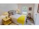 Comfortable bedroom with window, wood-look floors, and closet with furnishings at 153 Bywood Dr, Roxboro, NC 27573