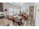 Dining area features a wood table, natural light, and views into the kitchen at 153 Bywood Dr, Roxboro, NC 27573