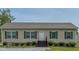 Charming home with a well-manicured front yard and neutral siding at 153 Bywood Dr, Roxboro, NC 27573